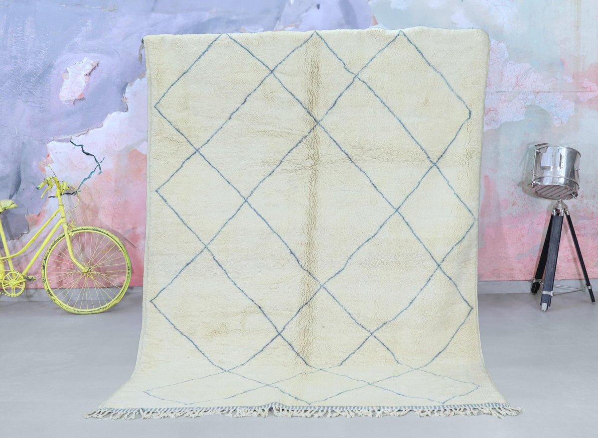 Custom Beni Ourain Moroccan rug handwoven from natural wool with a soft beige and blue diamond pattern.